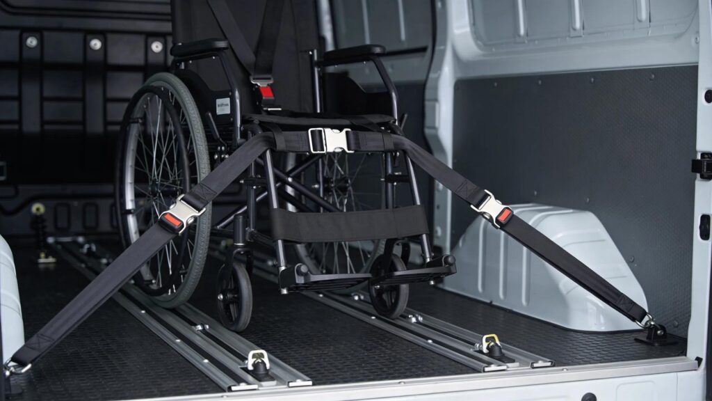 A van&rsquo;s wheelchair securement system, demonstrating safety measures for non-emergency wheelchair transport.